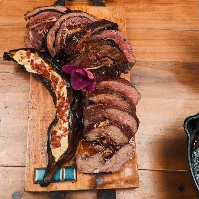 Rolled Picanha with Smoked Bacon, Caramelised Plantain & Melted Cheese