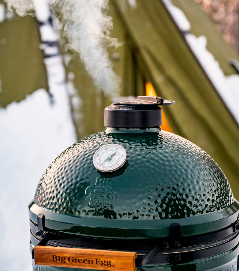 Big Green Egg smoking outdoors