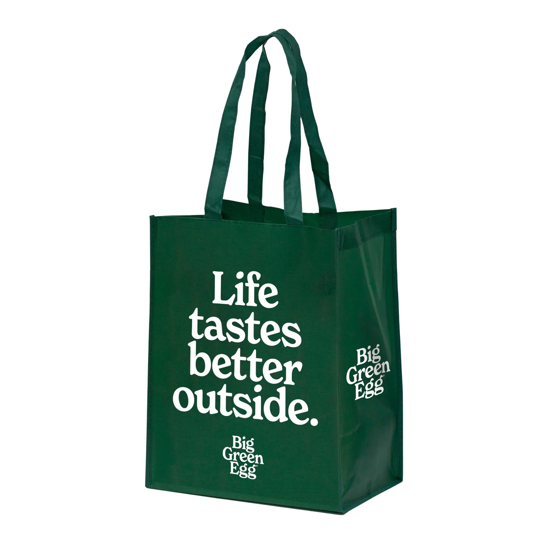 Green tote bag with 'Life tastes better outside' text on a white background