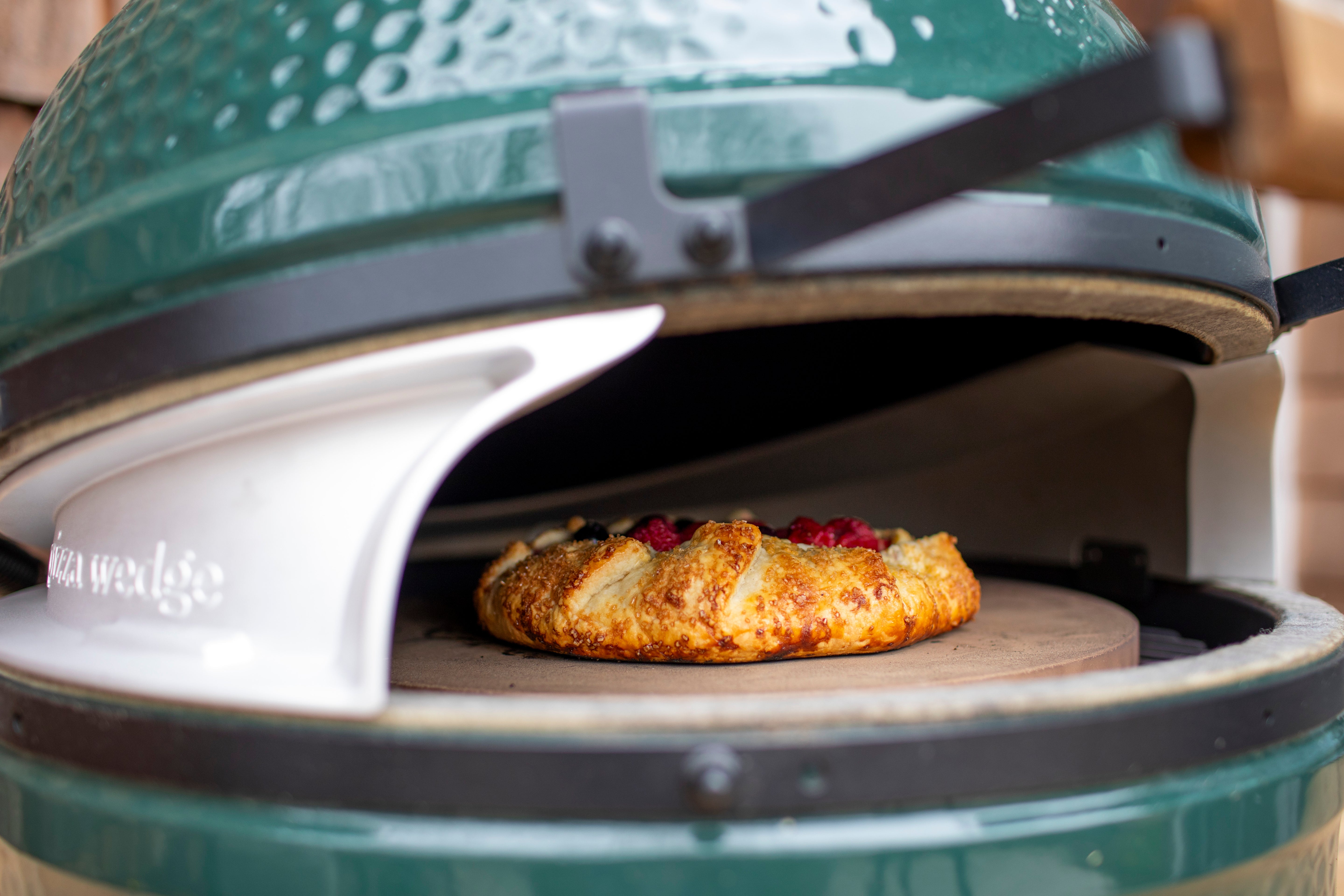 Green ceramic grill with a Galette inside
