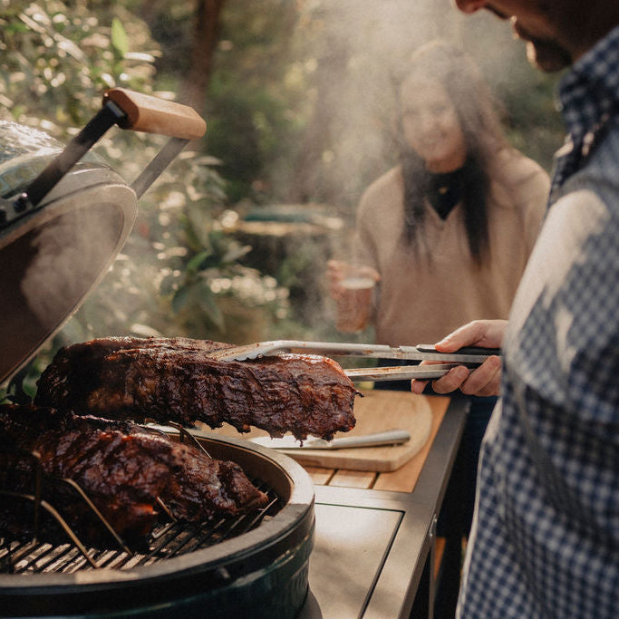 Family Smoking Ribs on Egg