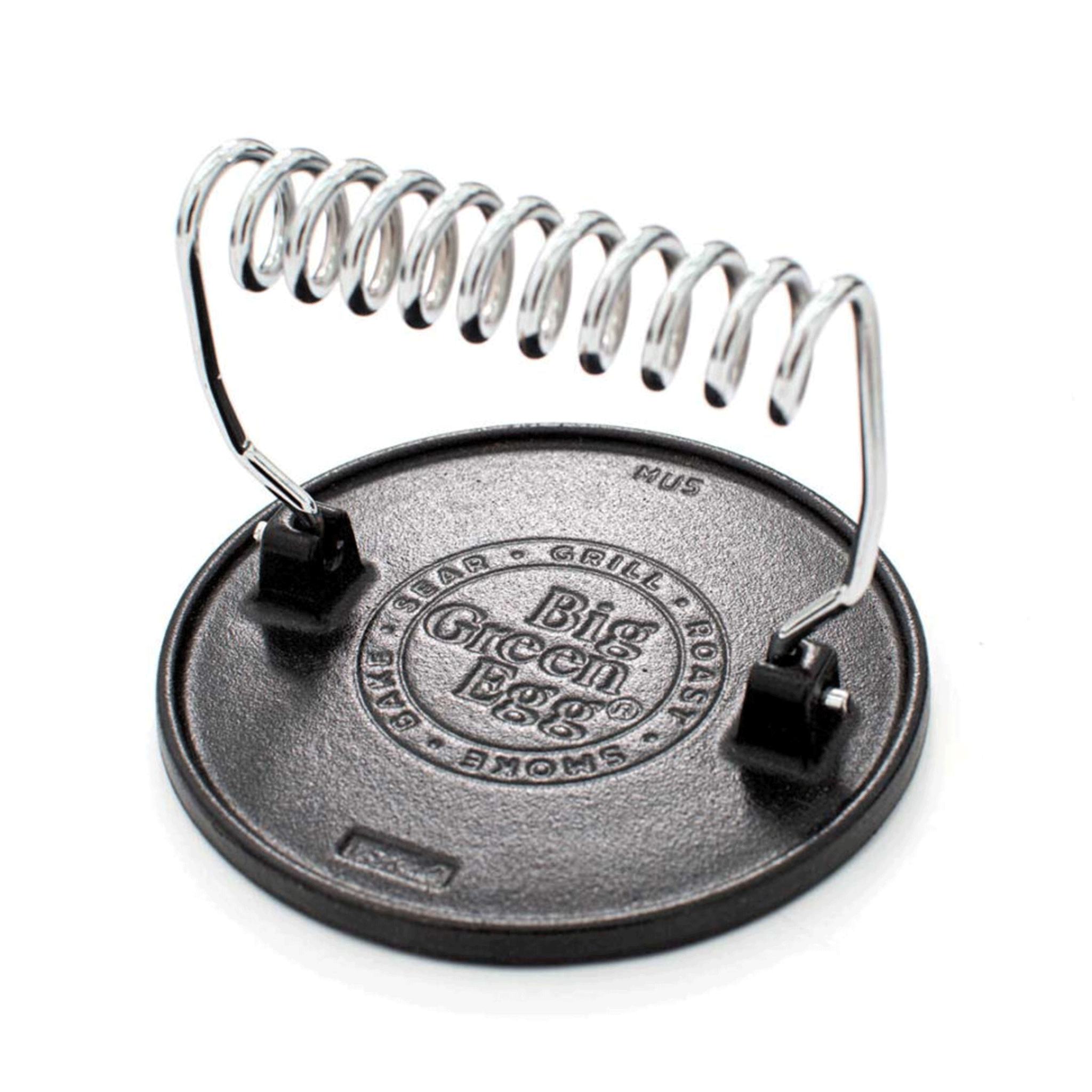 Big Green Egg grill press on a white background