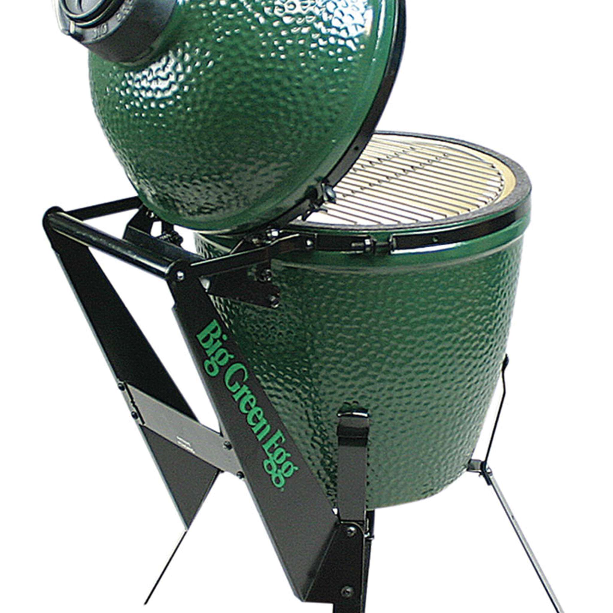 Green ceramic kamado grill with stand on a white background