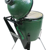 Green ceramic kamado grill with stand on a white background