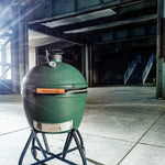 Green Big Green Egg grill in an industrial setting