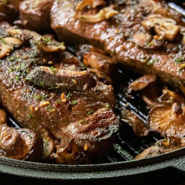 Cast Iron Seared Strip Steaks with Sautéed Wild Mushrooms