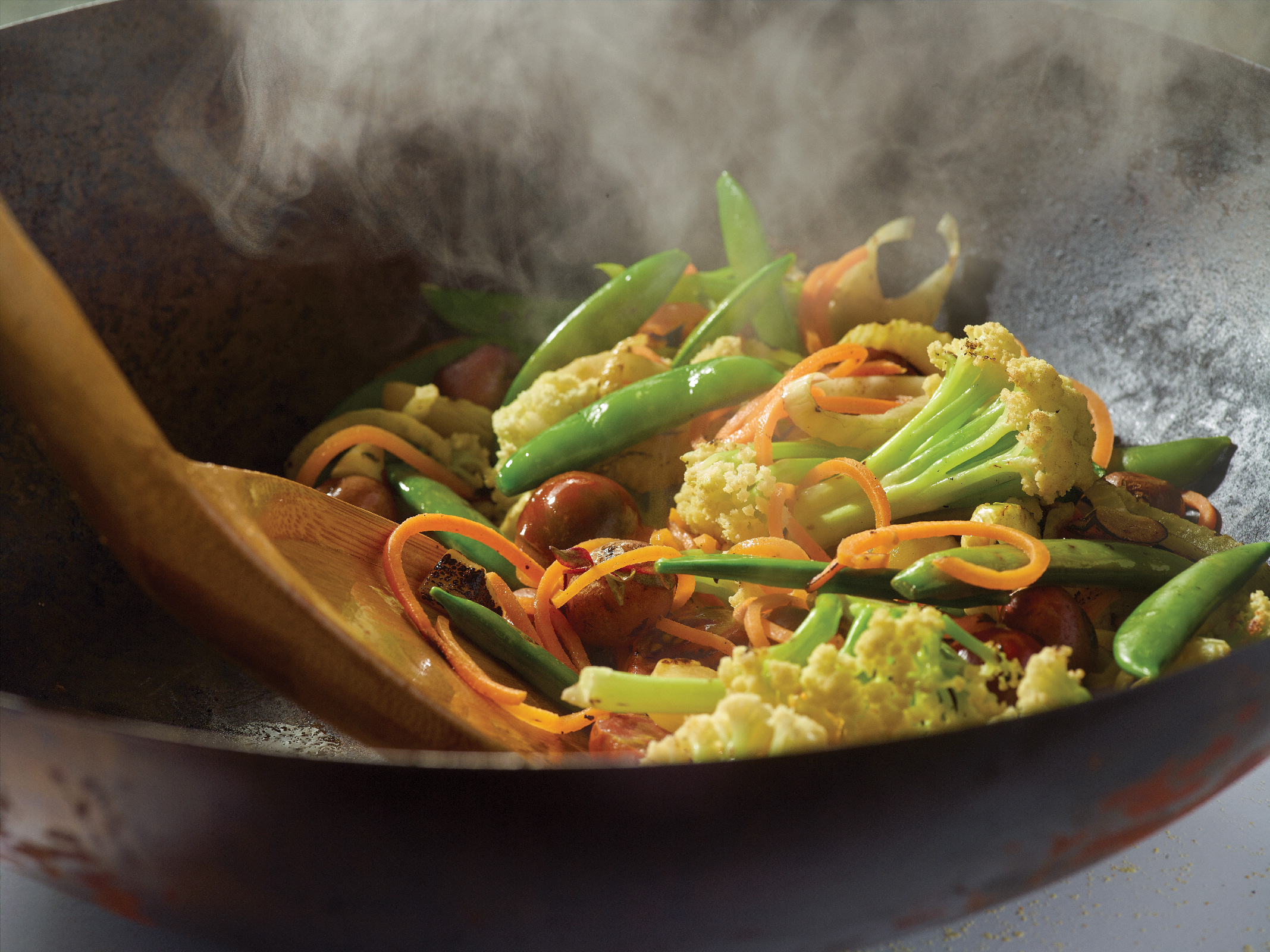 Stirring stir-fry in a wok