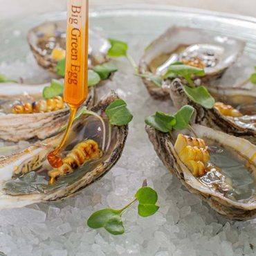 Emerald Oysters with charred corn and hot honey